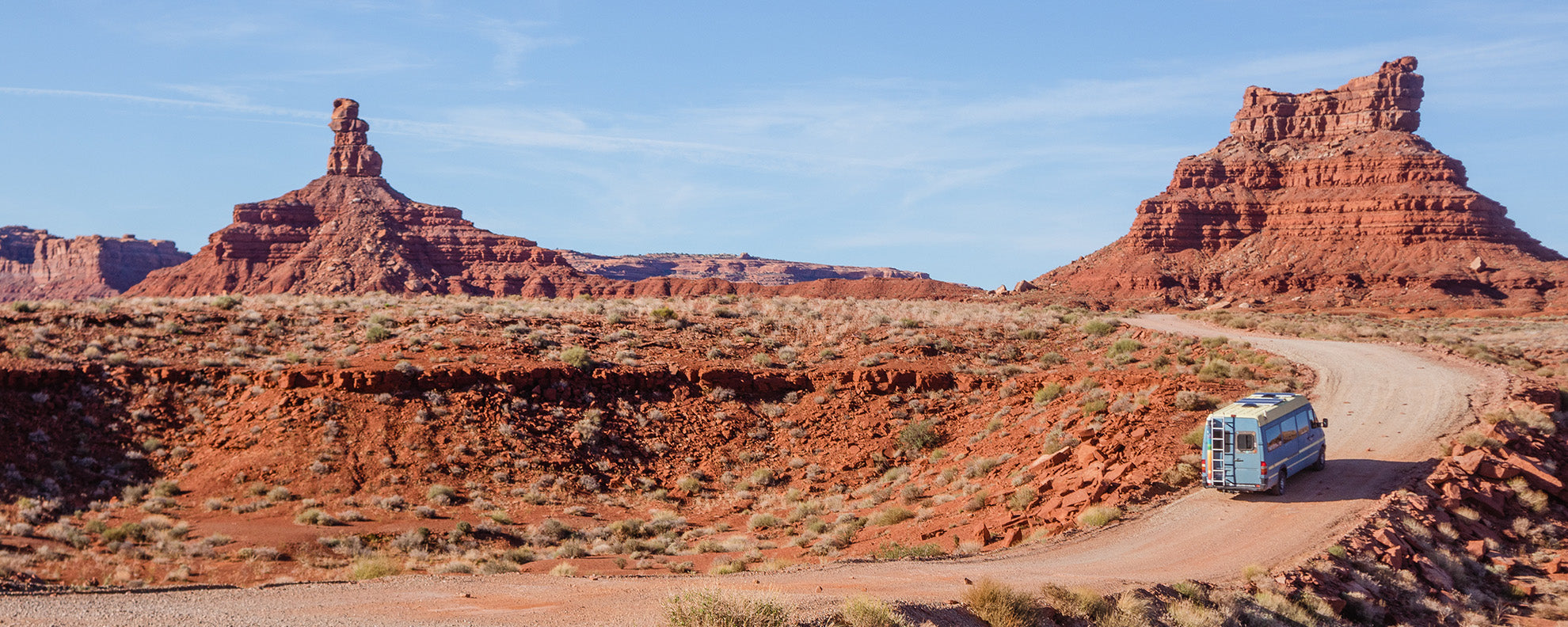 Van driving in a dry landscape